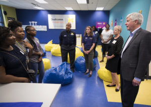 Former Michigan Governor Snyder and Jeanne Murabito speak with students at the Michigan Engineering Zone, while Julian Pate, Haley Hart, and LaShawn Sims listen in on the conversation.